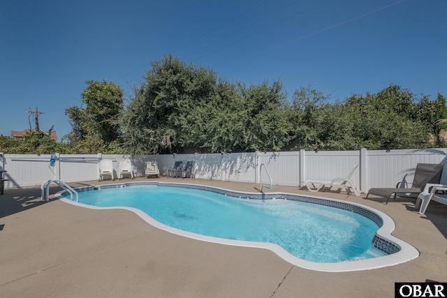view of pool featuring a fenced backyard, a fenced in pool, and a patio area