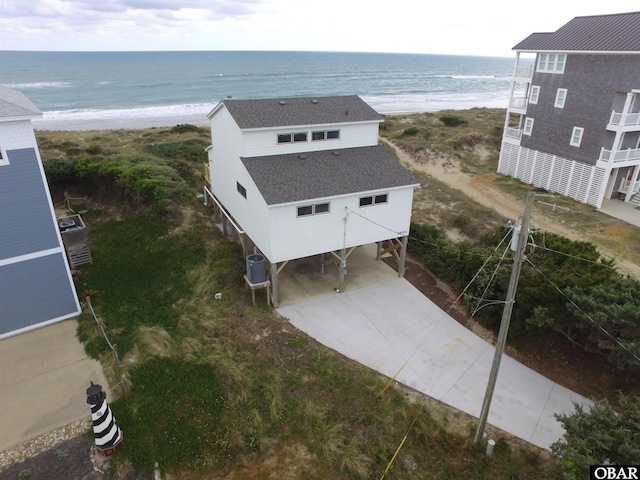 bird's eye view with a beach view and a water view