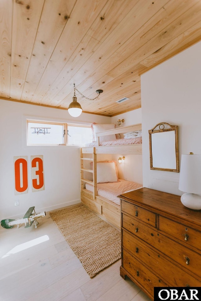 interior space with wood ceiling and wood finished floors