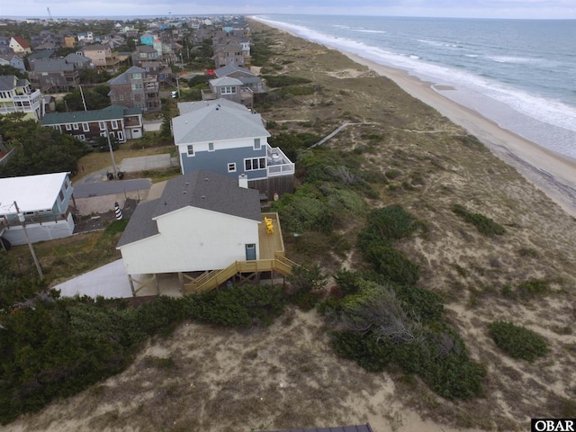 aerial view featuring a view of the beach and a water view