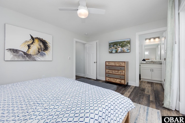 1206 Windance Ln Lot 103, Corolla, NC 27927 - bedroom featuring dark wood-style flooring, connected bathroom, baseboards, and a ceiling fan