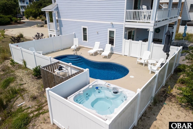 1206 Windance Ln Lot 103, Corolla, NC 27927 - swimming pool with a hot tub, a fenced backyard, and a patio