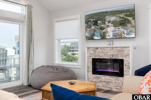 1206 Windance Ln Lot 103, Corolla, NC 27927 - living room with wood finished floors, plenty of natural light, and a fireplace