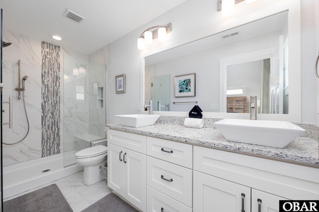 1206 Windance Ln Lot 103, Corolla, NC 27927 - bathroom featuring marble look tile flooring, double vanity, a marble finish shower, toilet, and recessed lighting