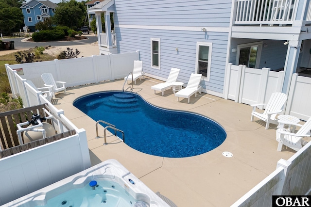 1206 Windance Ln Lot 103, Corolla, NC 27927 - view of swimming pool featuring an outdoor hot tub, a patio, and a fenced backyard