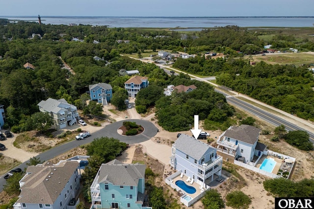 1206 Windance Ln Lot 103, Corolla, NC 27927 - aerial perspective of suburban area with a pool and a large body of water