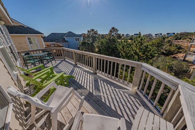 wooden deck featuring outdoor dining space