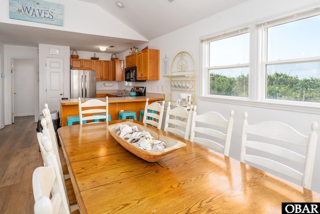 631 Skimmer Ct Lot 17, Corolla, NC 27927 - dining space with lofted ceiling and dark wood-style floors