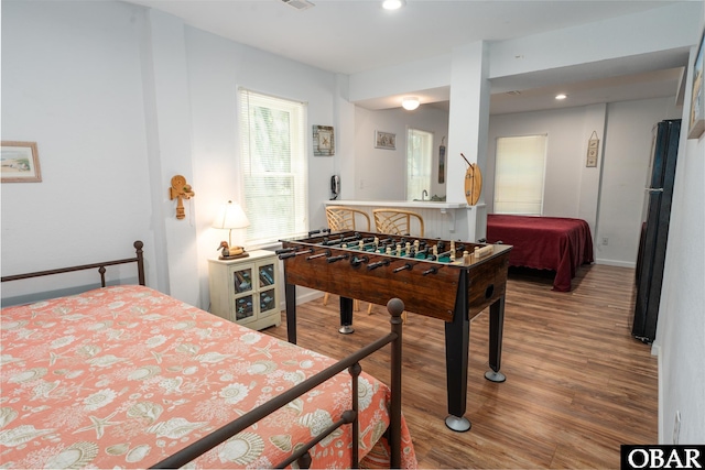 631 Skimmer Ct Lot 17, Corolla, NC 27927 - bedroom featuring wood finished floors, freestanding refrigerator, and recessed lighting