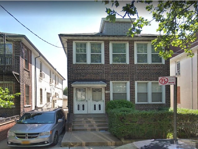 1068 51st St, Brooklyn, NY 11219 - view of front facade featuring brick siding and entry steps