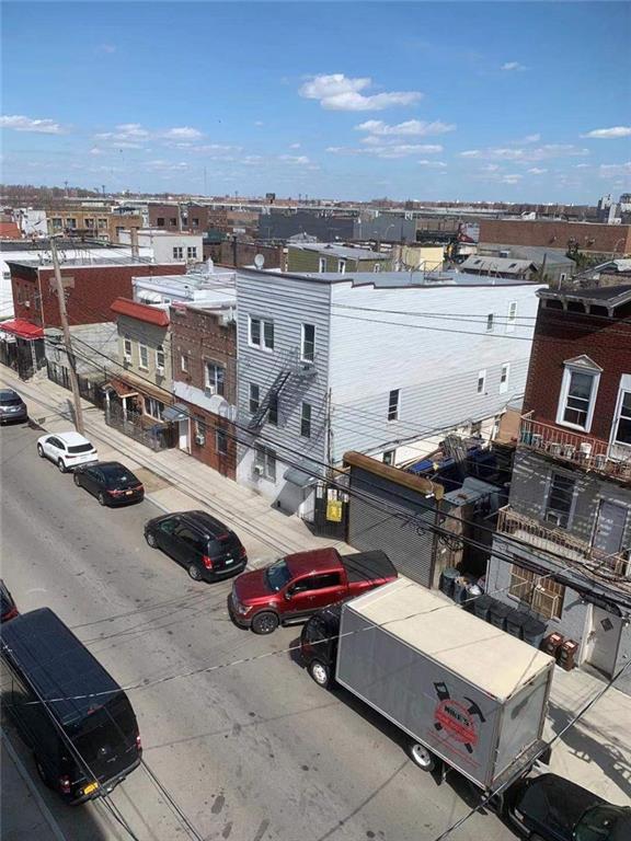 birds eye view of property with a view of city