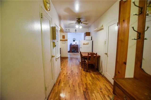 corridor with light wood-style flooring