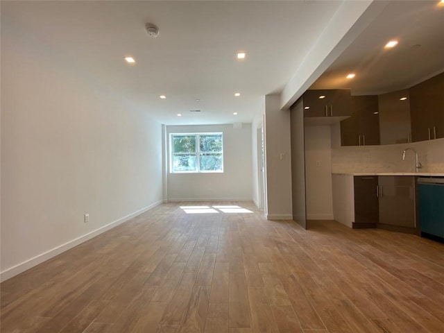 unfurnished living room with light hardwood / wood-style floors