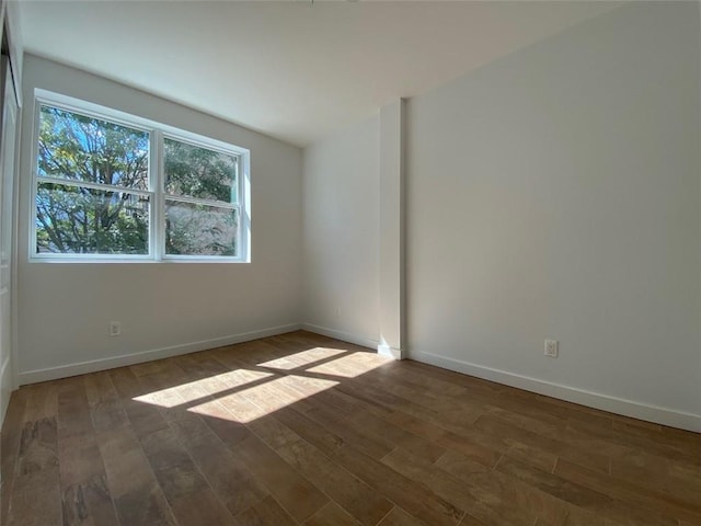 spare room featuring hardwood / wood-style floors