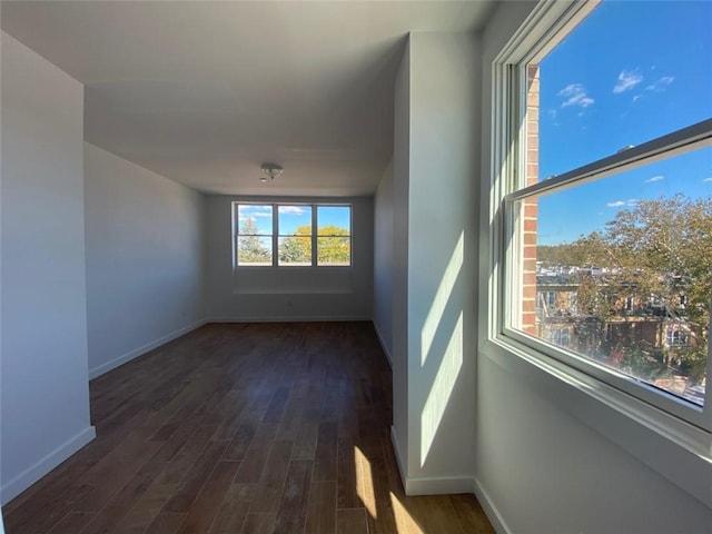 unfurnished room featuring hardwood / wood-style flooring