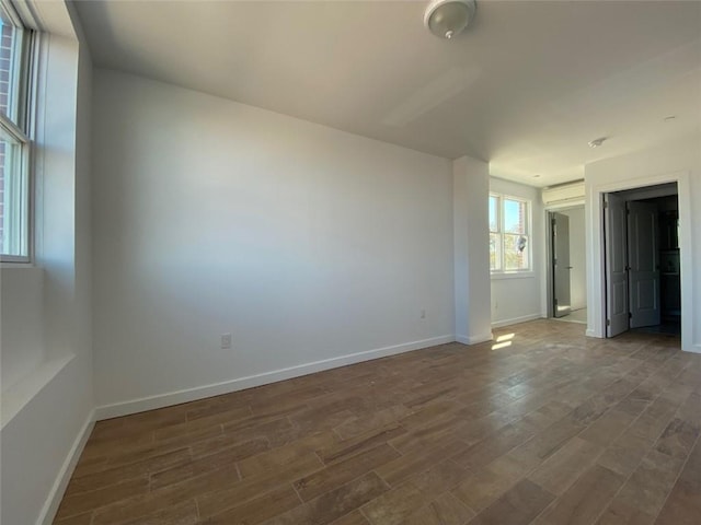 unfurnished room featuring hardwood / wood-style flooring