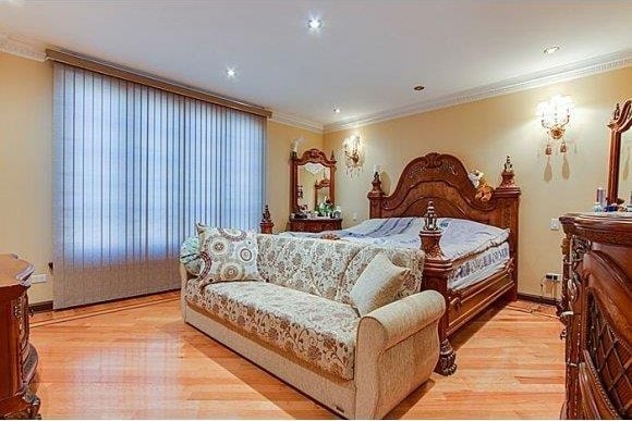 1366 70th St, Brooklyn, NY 11228 - bedroom with light wood finished floors, crown molding, baseboards, and recessed lighting