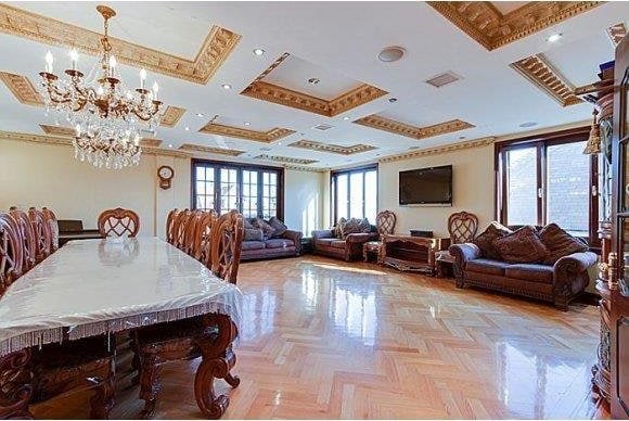1366 70th St, Brooklyn, NY 11228 - dining area featuring ornamental molding, a chandelier, coffered ceiling, and beamed ceiling