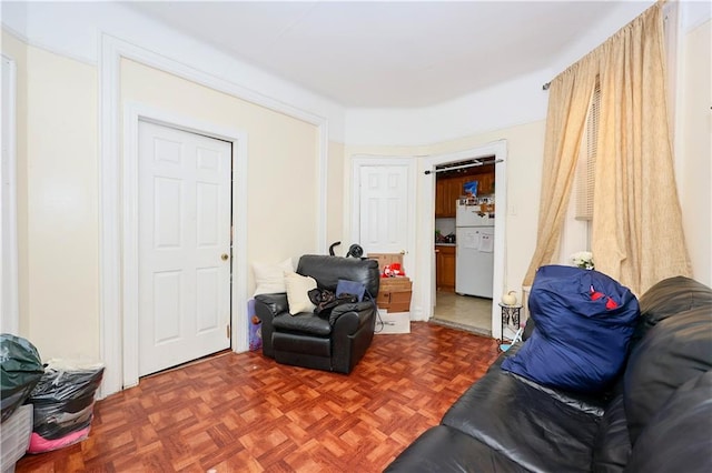 living area with dark parquet floors