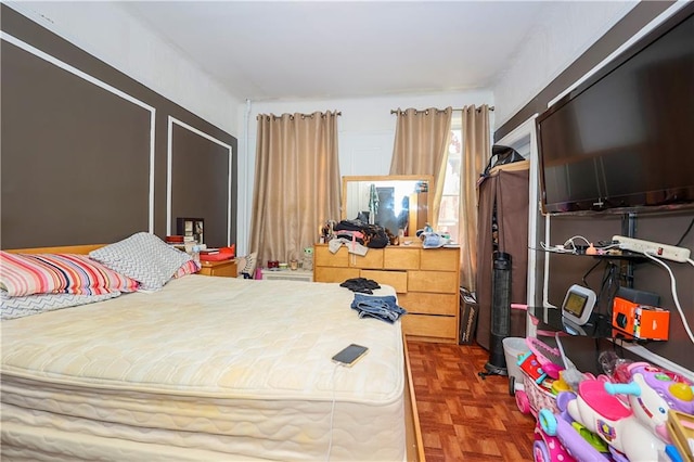 bedroom featuring parquet floors