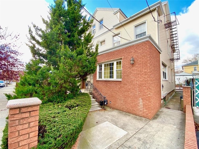 view of side of home with a patio