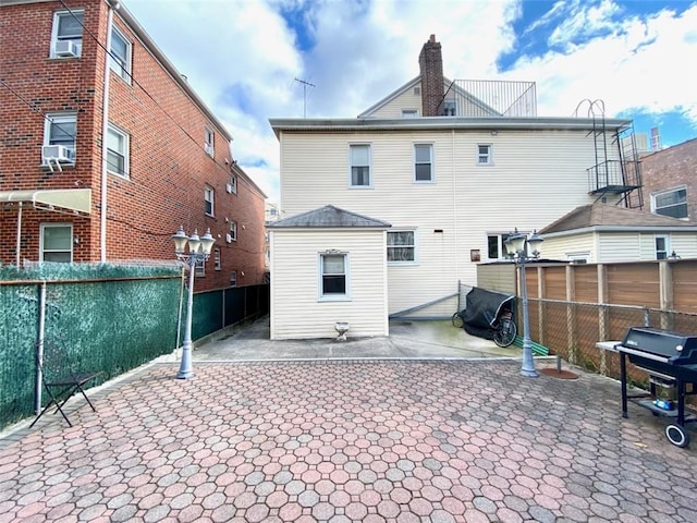 rear view of property with a patio area