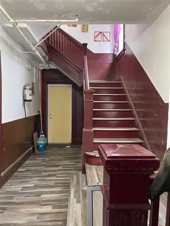 1809 Voorhies Ave, Brooklyn, NY 11235 - staircase featuring hardwood / wood-style flooring
