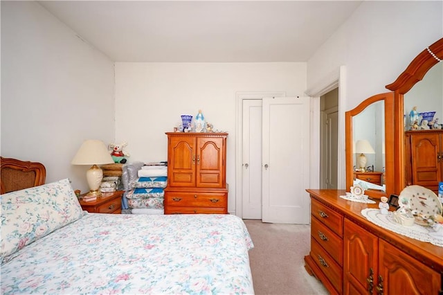 bedroom with light colored carpet