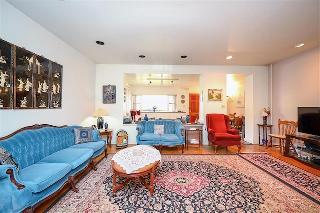 living room featuring wood finished floors and recessed lighting