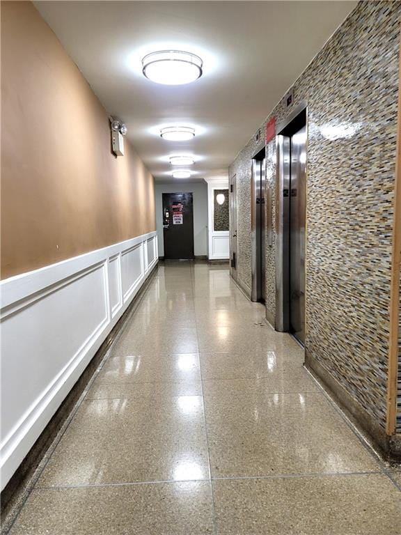 hallway featuring elevator