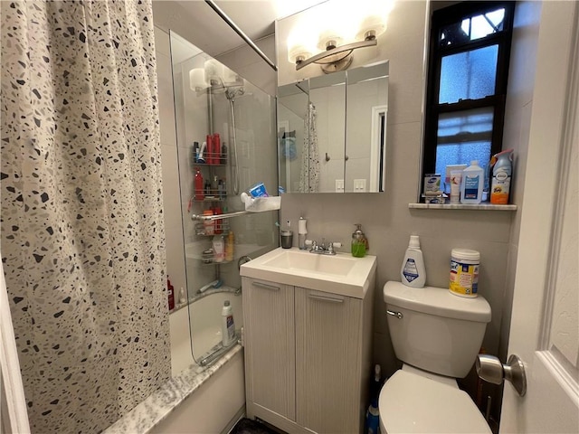 full bathroom with vanity, toilet, and bath / shower combo with glass door