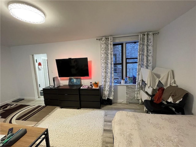 bedroom with hardwood / wood-style floors