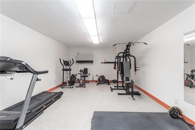 workout room with baseboards