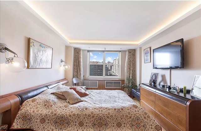 bedroom with a tray ceiling