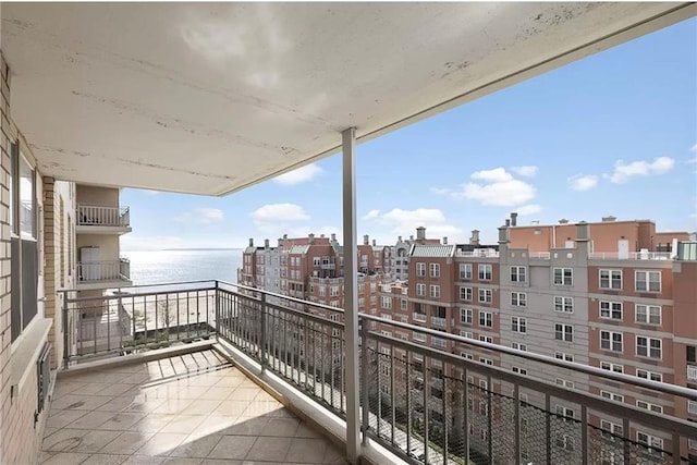 balcony featuring a water view