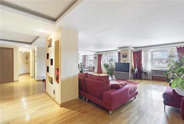 living room featuring light hardwood / wood-style flooring and a wealth of natural light