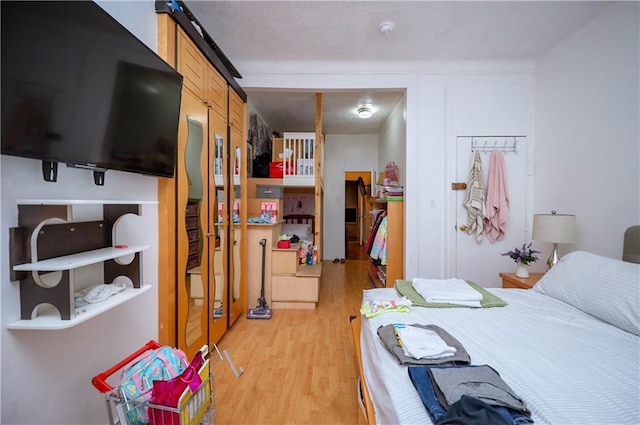 bedroom with light wood-type flooring