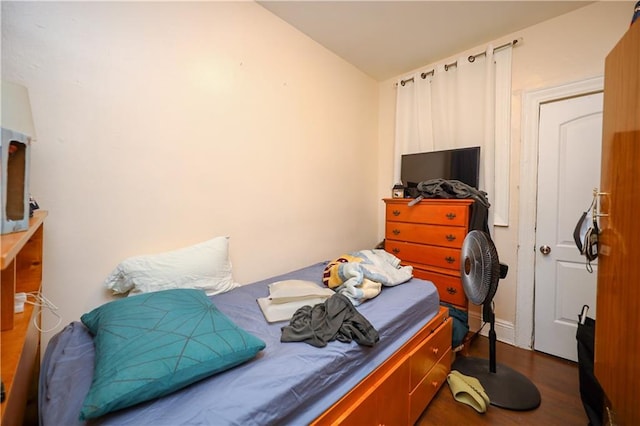 bedroom featuring dark hardwood / wood-style flooring