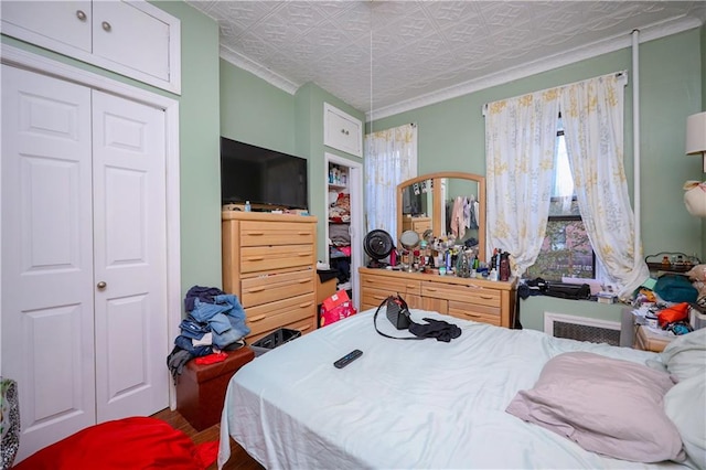 bedroom featuring a closet and wood-type flooring