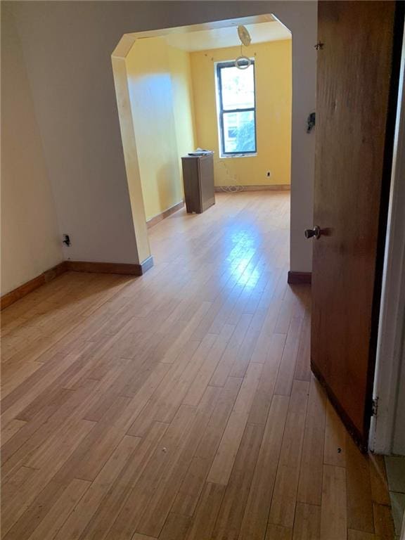 bonus room with light wood-type flooring