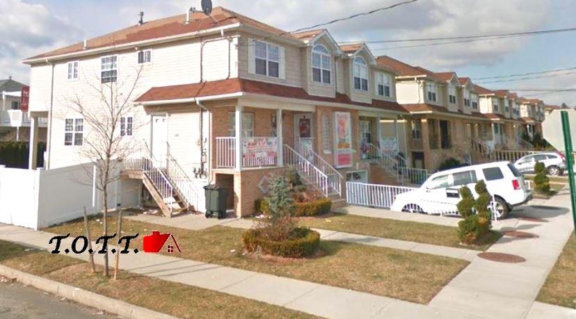 1384 E 70th St, Brooklyn, NY 11234 - view of property featuring a porch, a residential view, and stairs