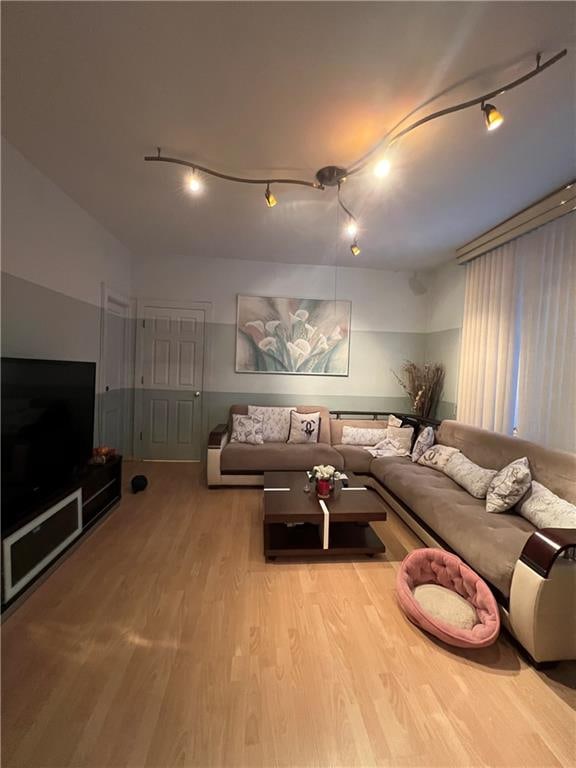 living room with light hardwood / wood-style floors