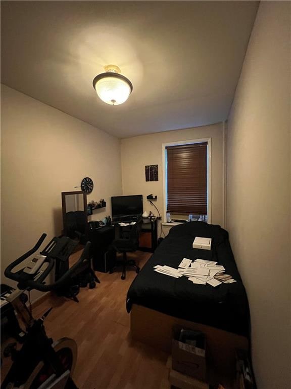 bedroom with hardwood / wood-style floors