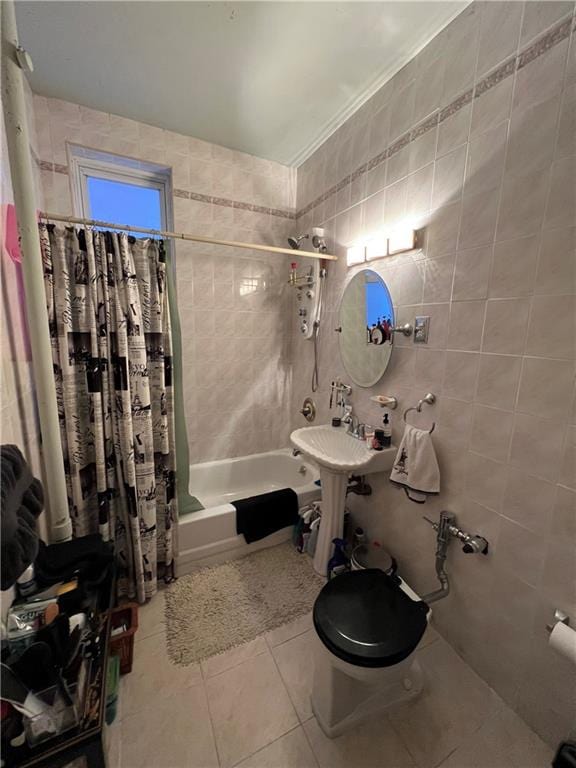 bathroom with toilet, tile walls, tile patterned flooring, ornamental molding, and shower / tub combo
