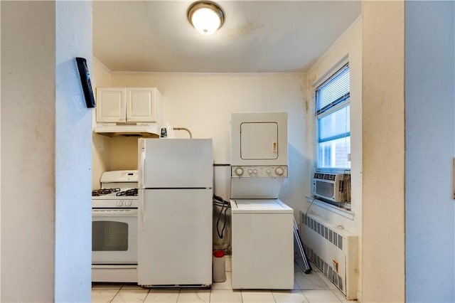 laundry room featuring crown molding, stacked washer / drying machine, radiator heating unit, cooling unit, and laundry area