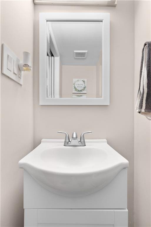 bathroom featuring visible vents and vanity