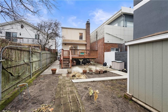 back of house featuring a patio area, a fenced backyard, stairs, and a wooden deck