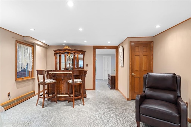 dining room with recessed lighting, a baseboard radiator, light carpet, a bar, and baseboards