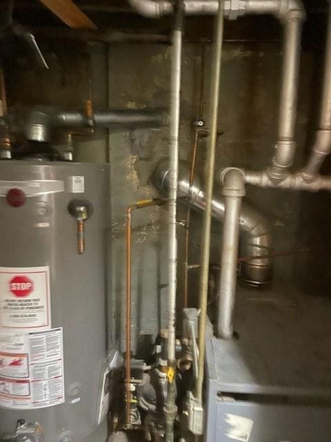 utility room featuring gas water heater