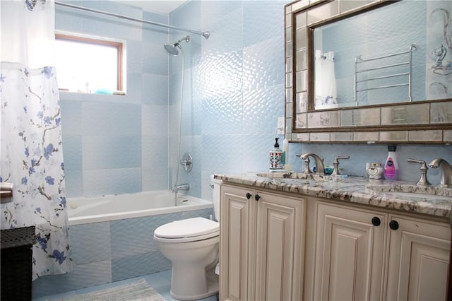 full bathroom featuring tile patterned flooring, shower / bath combination with curtain, vanity, and toilet